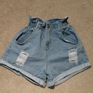 High-waisted, ruffle top shorts.